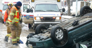 Rescuers responding to rollover car.