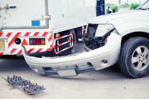 Car and truck collision along the highway.