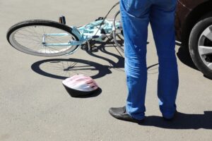 man checking damages to report to his bicycle accident attorney