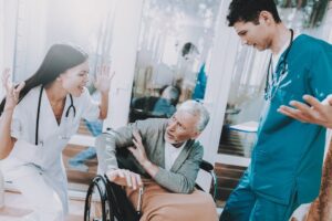 Medical workers threatening elderly senior.