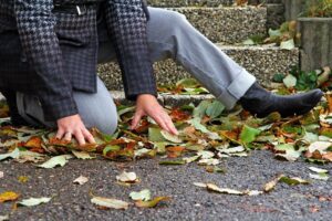 Woman slip and fall on wet and smooth road.