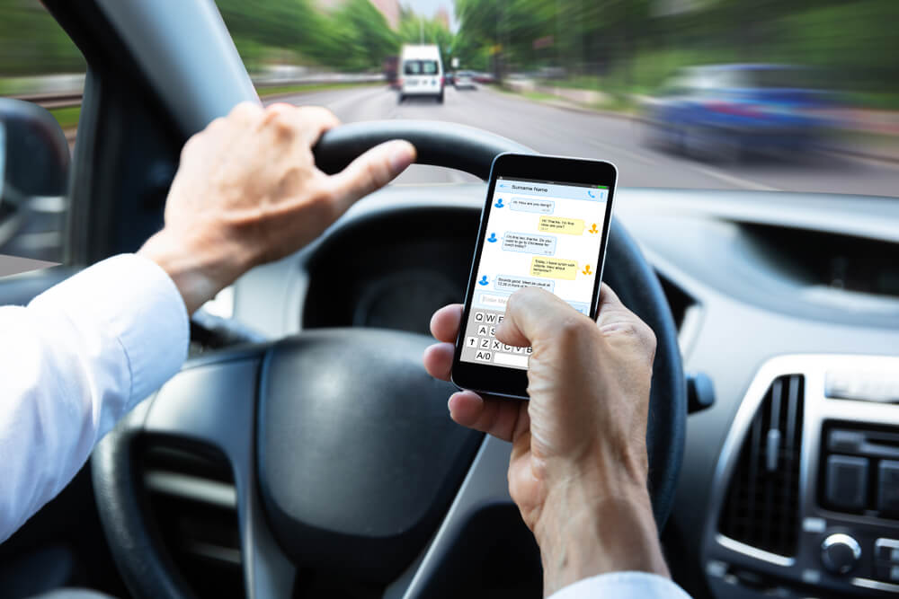 Driver texting while driving.