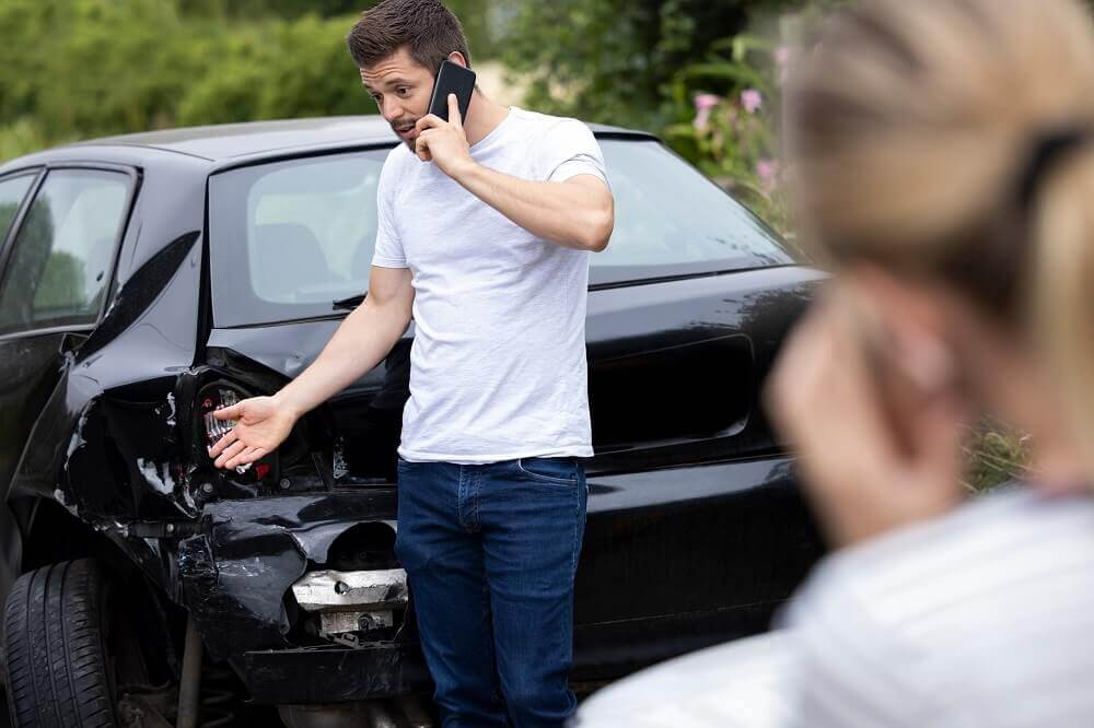 Driver calling the insurance company to report accident.