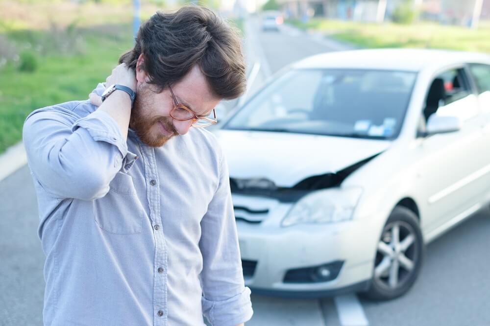 Driver suffering whiplash from car accident.