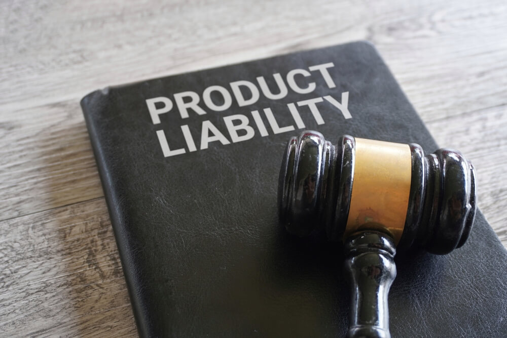 Product liability book on the table with gavel on top.