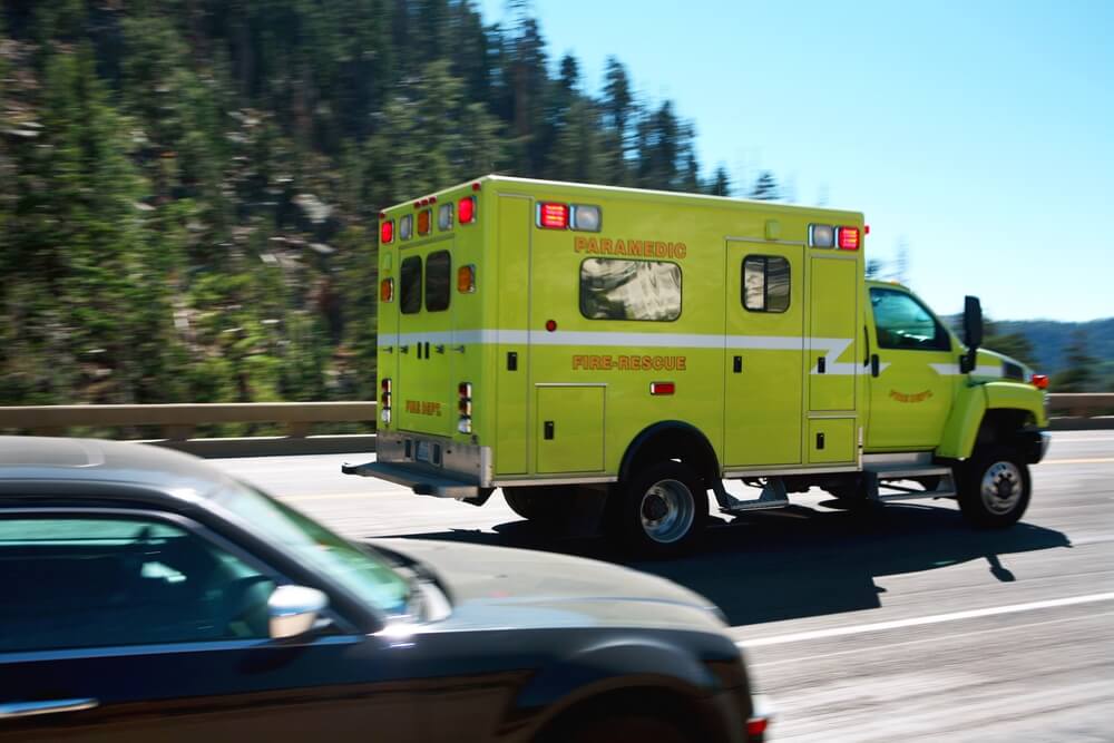 Paramedics ambulance passing in the highway.